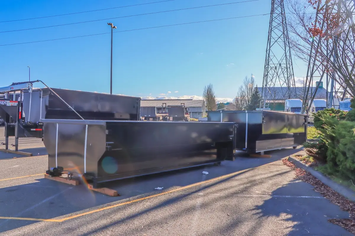Roll-off dumpster ready for waste disposal at job site for Concrete Dumpster Rental in Kirby